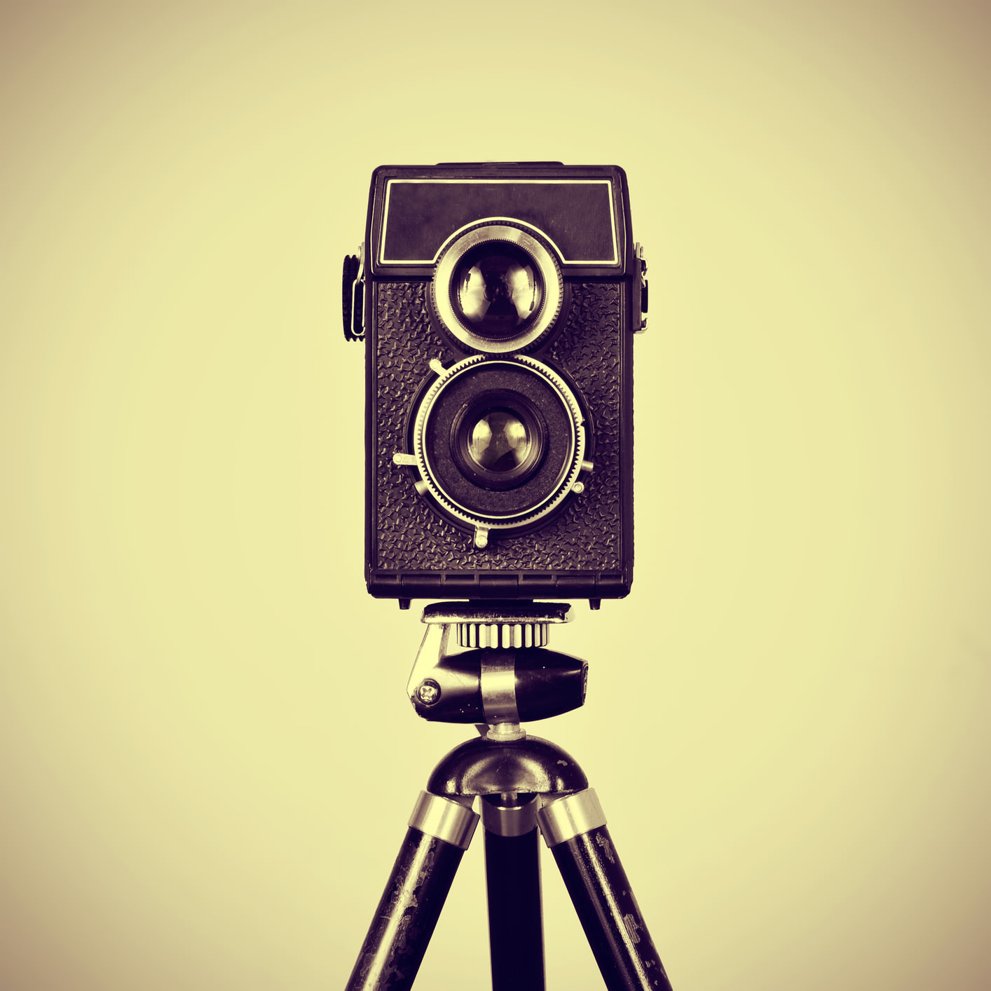 picture of an old camera in a tripod with a retro effect